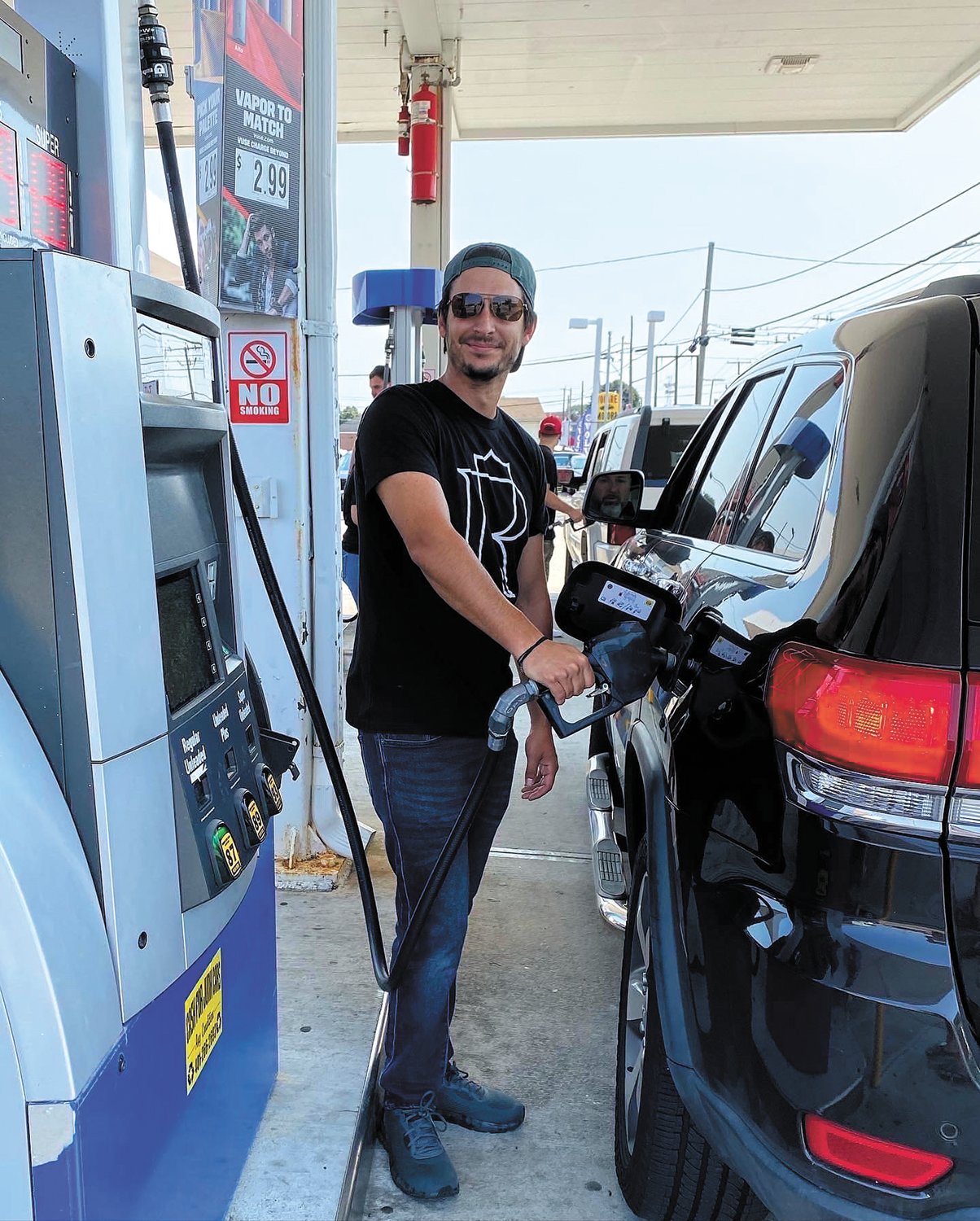 AT THE PUMP: Mike Moglia pumped free gas at Savers Mart on Park Avenue this past Saturday.